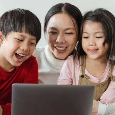 Mother with kids using laptop 2