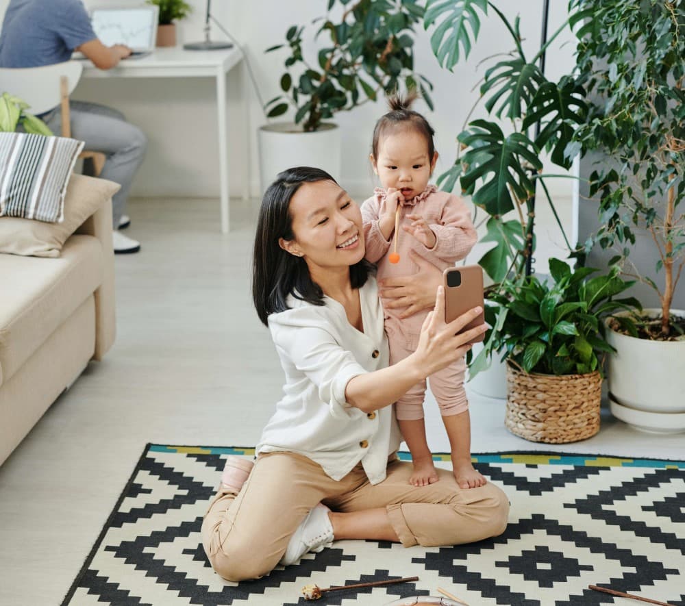 A parent taking a picture of their child.