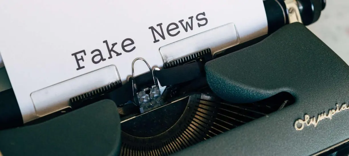 Typewriter with the word fake news typed into paper