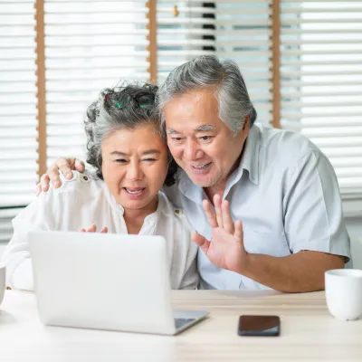 happy-asian-seniors-interacting-with-technology1