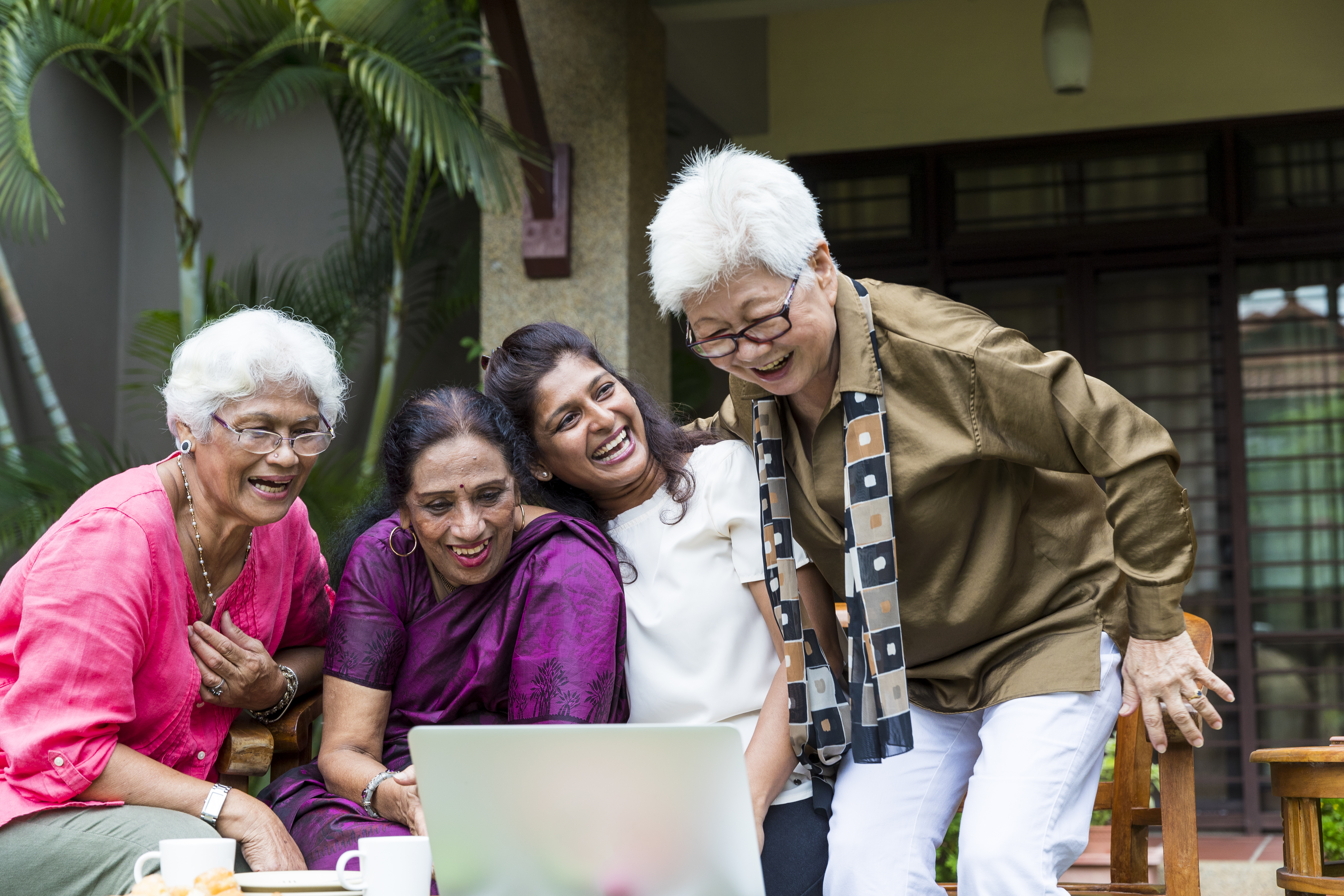 happy asian seniors interacting with technology3